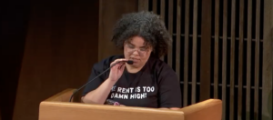 Cheyenne McGowan resident of the 5th District wearing a “rent is too damn high!” T-shirt.